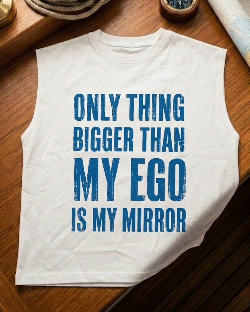 White sleeveless shirt with blue text on a wooden surface