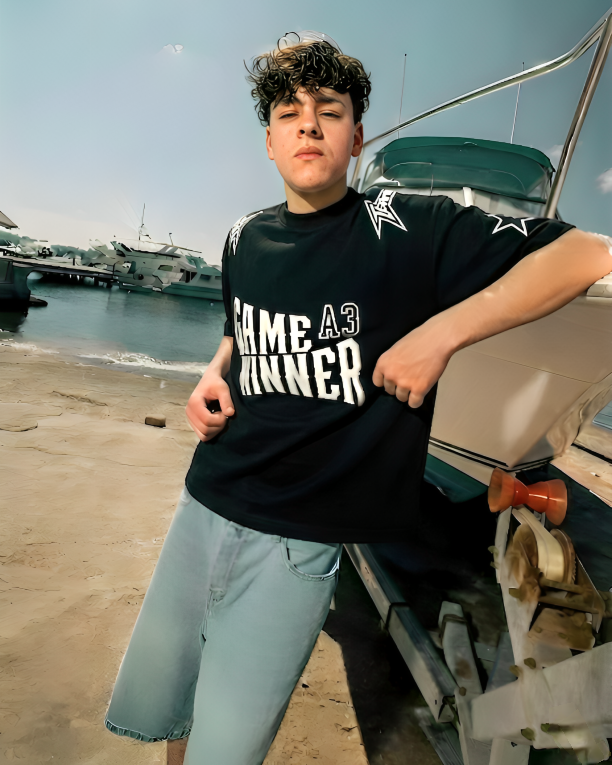 Person sitting on a boat with a clear blue sky in the background