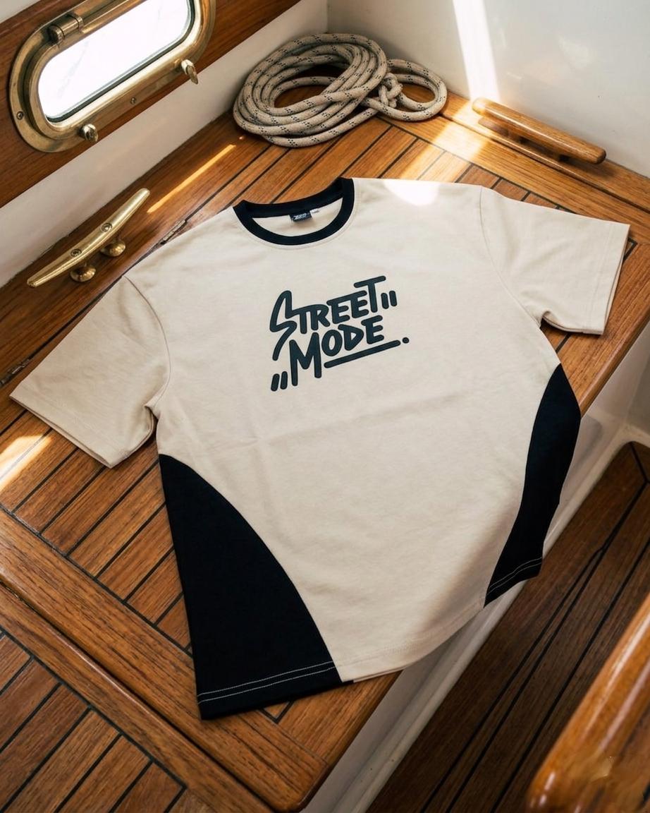White t-shirt with 'Street Mode' text on a wooden surface